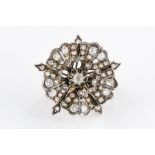 A VICTORIAN DIAMOND SET FLOWER BROOCH