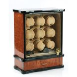 A RAPPORT NINE WATCH WINDER WITH A LOWER DRAWER