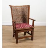 PROBABLY RETAILED BY LIBERTY; A WALNUT FRAMED ORKNEY CHAIR