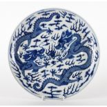 A LARGE CHINESE BLUE AND WHITE `DRAGON' DISH