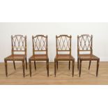 A SET OF FOUR REGENCY PARCEL GILT GREEN POLYCHROME PAINTED LATTICE BACK SIDE CHAIRS