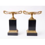 A PAIR OF FRENCH ORMOLU AND BLACK MARBLE TAZZE (2)