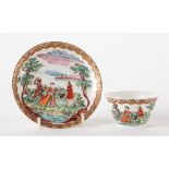 A JAPANESE PORCELAIN DUTCH-DECORATED TEABOWL AND SAUCER