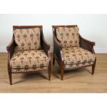 A PAIR OF REGENCY STYLE MAHOGANY FRAMED BERGERE ARMCHAIRS (2)