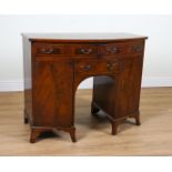 A GEORGE III STYLE CROSSBANDED MAHOGANY BOWFRONT KNEEHOLE SERVING TABLE