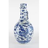 A TALL CHINESE BLUE AND WHITE BOTTLE-SHAPED VASE