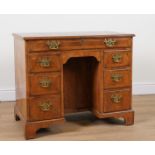 A MID 18TH CENTURY STYLE FEATHER BANDED WALNUT KNEEHOLE WRITING DESK