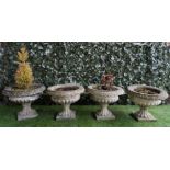 A SET OF FOUR RECONSTITUTED STONE SEMI-FLUTED JARDINIERES (4)