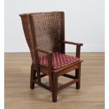 PROBABLY RETAILED BY LIBERTY; A WALNUT FRAMED ORKNEY CHAIR