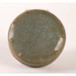 A CHINESE CELADON GLAZED CIRCULAR SHALLOW BOX AND COVER (2)