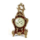 A FRENCH ORMOLU-MOUNTED TORTOISESHELL MANTEL CLOCK