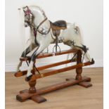 A PAINTED DAPPLE GREY ROCKING HORSE