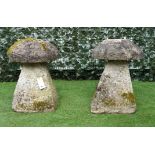 A PAIR OF CARVED STONE STADDLE STONES (2)