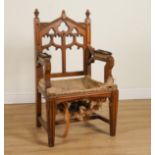 A VICTORIAN OAK GOTHIC REVIVAL OPEN ARMCHAIR