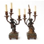A PAIR OF FRENCH LOUIS XVI STYLE GILT AND PATINATED BRONZE THREE LIGHT CANDELABRA AFTER...