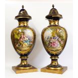 A LARGE PAIR OF SEVRES-STYLE EARTHENWARE VASES AND ASSOCIATED PORCELAIN COVERS