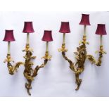 A PAIR OF FRENCH LOUIS XV STYLE ORMOLU THREE LIGHT WALL APPLIQUES (2)