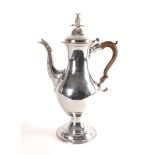 A GEORGE III SILVER COFFEE POT