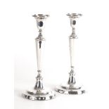 A PAIR OF SILVER TABLE CANDELSTICKS