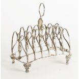 A GEORGE III SILVER SEVEN BAR TOASTRACK