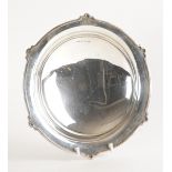 A SILVER SHAPED CIRCULAR DISH