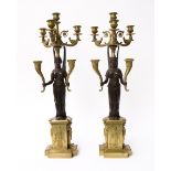 A PAIR OF FRENCH EMPIRE GILT AND PATINATED BRONZE SIX-LIGHT CANDELABRA (2)