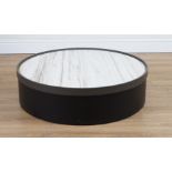 A MODERN CIRCULAR LOW COFFEE TABLE