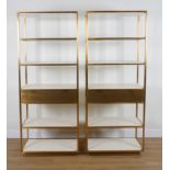 A PAIR OF BRASS FLOOR STANDING OPEN BOOKCASES