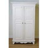 A MODERN WHITE PAINTED TWO DOOR WARDROBE