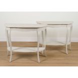 A PAIR OF MODERN PAINTED SHAPED DEMI-LUNE TWO TIER SIDE TABLES (2)