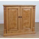 A MODERN OAK TWO DOOR TELEVISION CABINET