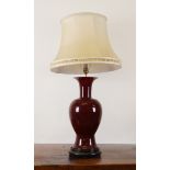 A CHINESE SANG DE BOEUF BALUSTER TABLE LAMP