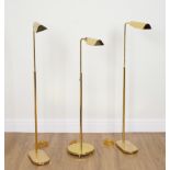 THREE BRASS LACQUERED FLOOR STANDING READING LIGHTS (3)