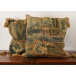 A PAIR OF FLEMISH VERDURE TAPESTRY FRAGMENT CUSHIONS (2)