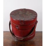 A RED PAINTED CANVAS SHOT CORDITE CARRIER WITH ROYAL COAT-OF-ARMS
