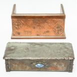 A SPOT HAMMERED COPPER TOBACCO BOX AND AN ARTS & CRAFTS COPPER MOUNTED OAK BOOK TROUGH (2)