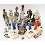 A GROUP OF FIGURAL CERAMIC DECANTERS (QTY)