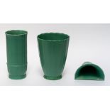 KEITH MURRAY FOR WEDGWOOD: TWO MATT GREEN GLAZED VASES AND A WALL POCKET (3)