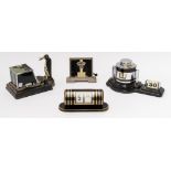 AN ART DECO CHROME PLATED AND BLACK ENAMEL ‘ODEON’ BAROMETER AND TWO PERPETUAL CALENDARS (4)
