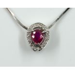 A WHITE GOLD, RUBY AND DIAMOND PENDANT WITH A WHITE GOLD NECKCHAIN