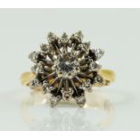 A GOLD AND DIAMOND CLUSTER RING