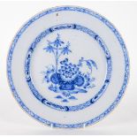 AN ENGLISH DELFTWARE BLUE AND WHITE LARGE PLATE