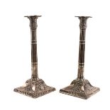 A PAIR OF SILVER TABLE CANDLESTICKS