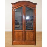 A 19TH CENTURY FRENCH MAHOGANY ARCH TOP TWO DOOR BOOKCASE