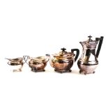 A SILVER THREE PIECE TEA SET AND A PLATED HOT WATER JUG (4)