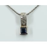 A WHITE GOLD, SAPPHIRE AND DIAMOND PENDANT WITH A WHITE GOLD NECKCHAIN