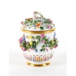 A MEISSEN FLOWER ENCRUSTED CUP AND PIERCED COVER