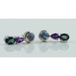 A PAIR OF WHITE GOLD AND VARICOLOURED GEM SET THREE STONE EARRINGS