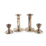 TWO PAIRS OF SILVER CANDLESTICKS (2)
