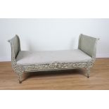 A VICTORIAN GREEN PAINTED CAST IRON DAY BED